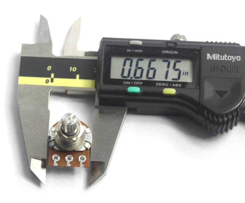 A picture showing a caliper measuring a 5k rotary potentiometer .6675 inches 