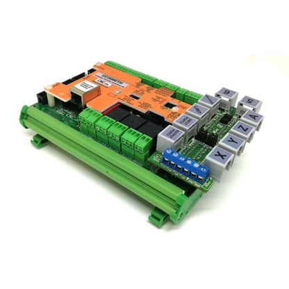 Angled view of C76 CNC breakout board showing green screw terminals, IDC expansion ports, and relay connections