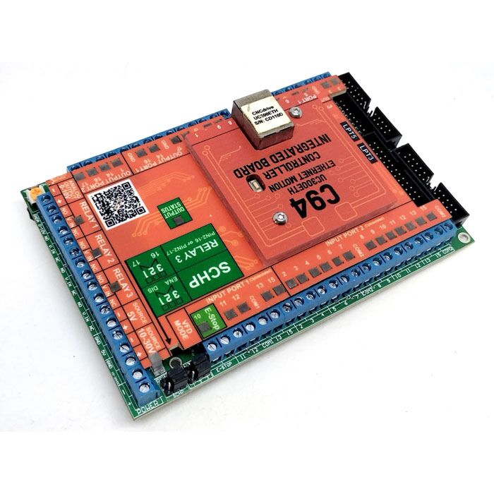 Angled view of the C94 CNC breakout board showing optoisolated input terminals, relay section, safety charge pump jumper and expansion headers