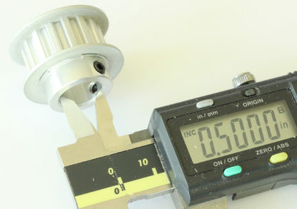 XL 15 teeth drive pulley 1/2" bore .2" pitch shown with caliper on the bore diameter. The measurement reads .5 inches. 