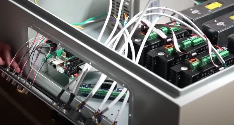Custom plug-and-play CNC control electronics cabinet with stepper drivers and wiring